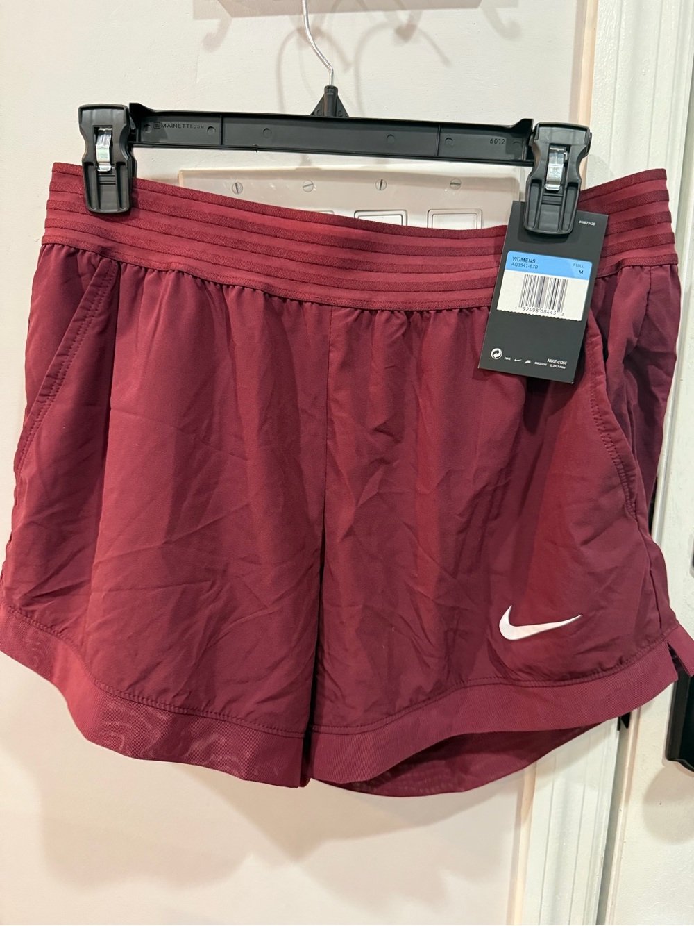 Nike Women's Burgundy Athletic Shorts with White Swoosh